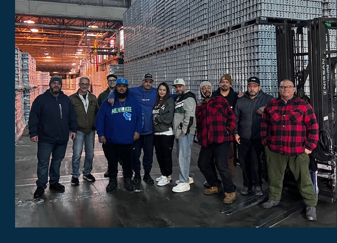 Man and woman warehouse workers with clipboard